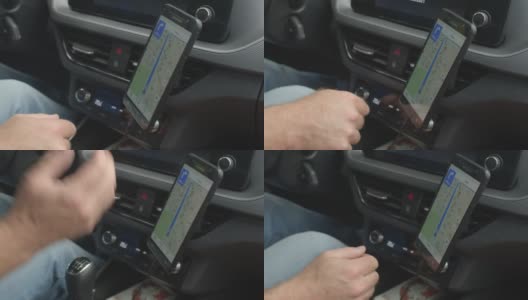 手机屏幕，导航搜索加油站司机保持手把手。高清在线视频素材下载