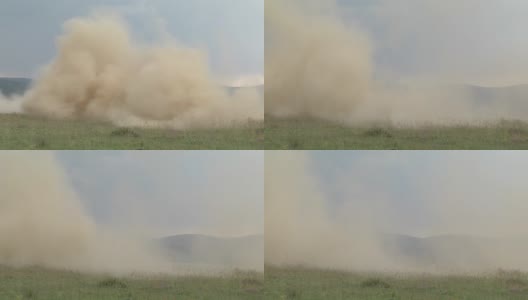 一团团的尘土滴在绿色的田野上高清在线视频素材下载