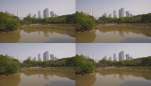 白天时间佛山城市公园池塘住宅综合体建设慢镜头全景4k中国高清在线视频素材下载