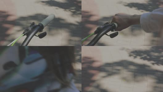 女性手触摸自行车车把的慢动作。近距离女子手握自行车车把高清在线视频素材下载