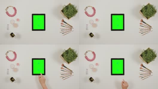 女人的手指在绿色触摸屏上滚动高清在线视频素材下载