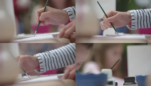 孩子用画笔画画高清在线视频素材下载