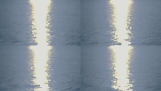 By the Sea -一个完全散焦的4k镜头的波浪水面与美丽的散焦反射光无缝环高清在线视频素材下载