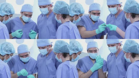 手术室里的一组外科医生高清在线视频素材下载