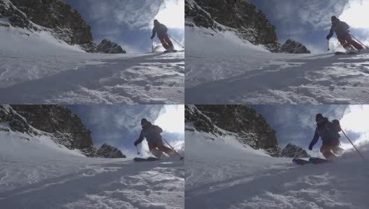 乡间滑雪者下山，积着厚厚的粉雪高清在线视频素材下载