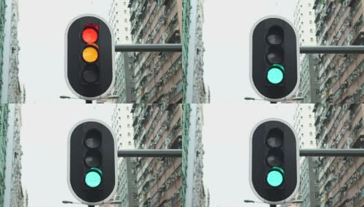 街道交通红灯以城市高楼为背景高清在线视频素材下载