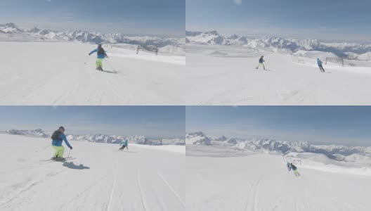 两个高山滑雪者在山坡上快速滑行高清在线视频素材下载