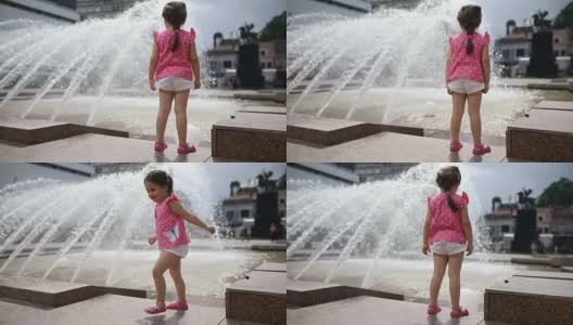 美丽的小女孩站在城市喷泉旁高清在线视频素材下载