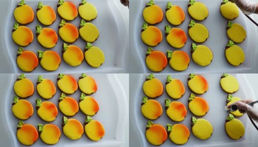 糕点师用喷漆把饼干装饰成苹果的形状高清在线视频素材下载