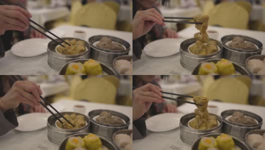 用餐者用筷子夹起点心高清在线视频素材下载