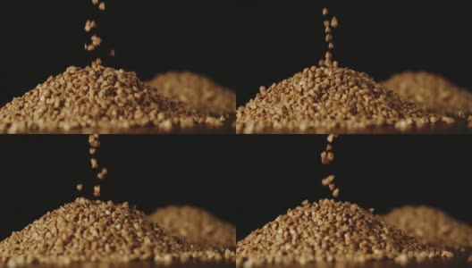 慢动作:荞麦粒倒在桌子上-近距离高清在线视频素材下载