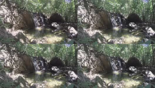 阳光森林里的瀑布高清在线视频素材下载