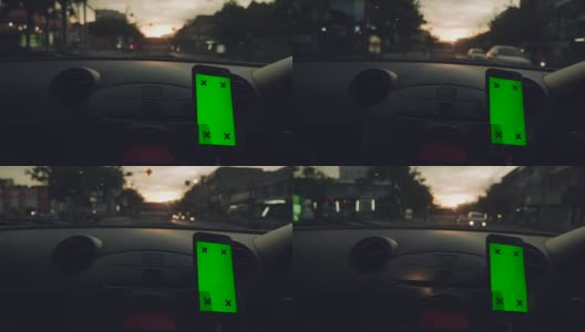 亚洲女性在车里使用智能手机的特写，绿屏高清在线视频素材下载