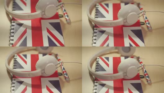 学习英语课程标志概念与英国国旗和耳机。英语学校标识高清在线视频素材下载