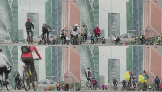 自行车城市赛事在摩天大楼的背景下竞争，成群的自行车手从成千上万的人骑自行车，在模糊中认不出的人，时间流逝高清在线视频素材下载
