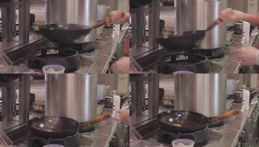 厨师将食材放入厨房烤锅中，在空气中搅拌高清在线视频素材下载