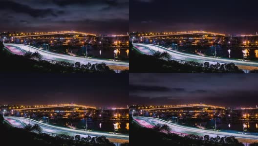 在海上亮着灯的桥和高速公路上行驶的汽车的时间流逝高清在线视频素材下载