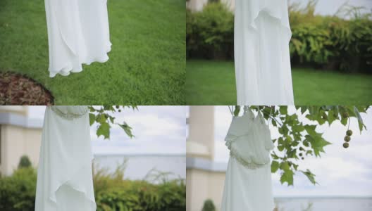 白色婚纱挂在衣服上供衣架使用。近距离高清在线视频素材下载