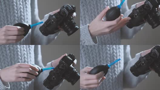 摄影师用吹风机清洁镜头高清在线视频素材下载