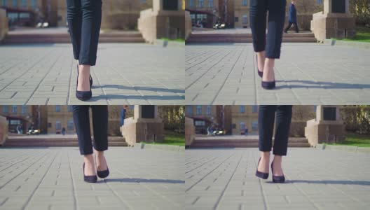 女人的脚在市中心行走的特写镜头。穿着高跟鞋的女商人高清在线视频素材下载