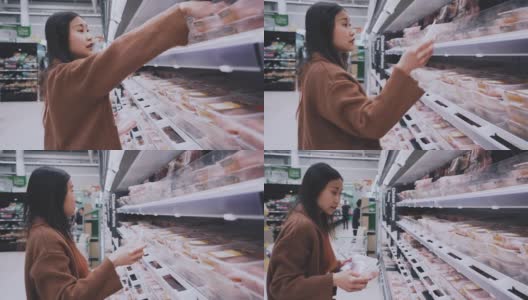 年轻女子选择肉类在超市购物高清在线视频素材下载
