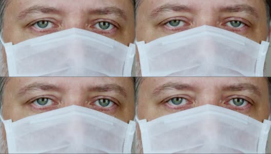 戴医用口罩的绿眼人高清在线视频素材下载