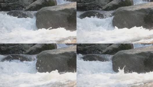 小河流流经泰国苏梅岛的岩石，欣拉德瀑布，慢拍高清在线视频素材下载