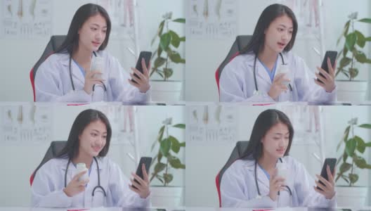 慢动作亚洲女医生通过视频聊天在线咨询患者关于症状和药物高清在线视频素材下载