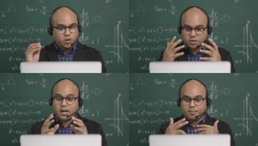 印度年轻教师男子戴着耳机坐着用笔记本电脑进行在线视频会议直播。亚洲数学教师在线授课，供学生在线学习。高清在线视频素材下载