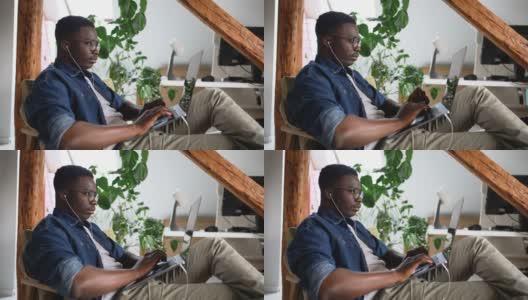 一个年轻人舒舒服服地在家工作高清在线视频素材下载