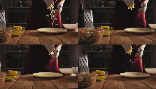 厨师双手戴着手套，把磨碎的奶酪扔在木桌上的玉米饼上高清在线视频素材下载