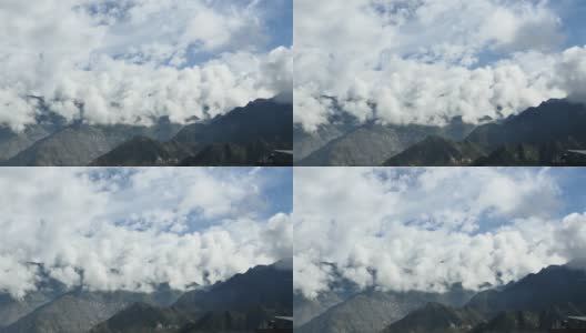 4千片蓬松的云团翻滚在西藏的山顶和山谷，世界之巅。高清在线视频素材下载