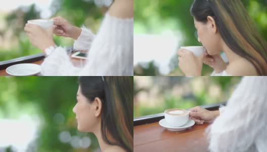 一个亚洲女人在花园里喝咖啡高清在线视频素材下载