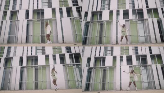 街舞女子在城市人行道上跳自由式舞蹈高清在线视频素材下载