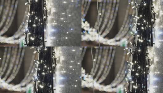 许多发光的LED灯泡在室内。这些是用来做圣诞装饰的。卡车从右向左射击。焦点在前面，背景模糊了。主题在右边。高清在线视频素材下载