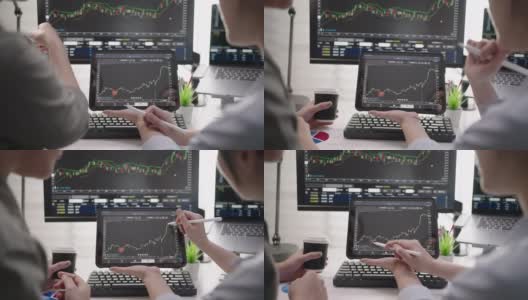 两个女商人使用数字平板电脑分析股票市场数据图高清在线视频素材下载