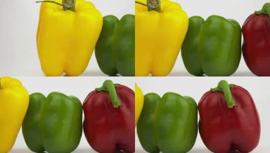 摄像机沿着三种不同颜色的辣椒移动高清在线视频素材下载