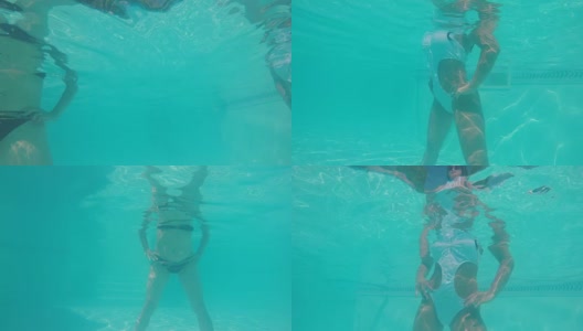 从水下拍摄与妇女在游泳池的水做水上健身练习高清在线视频素材下载