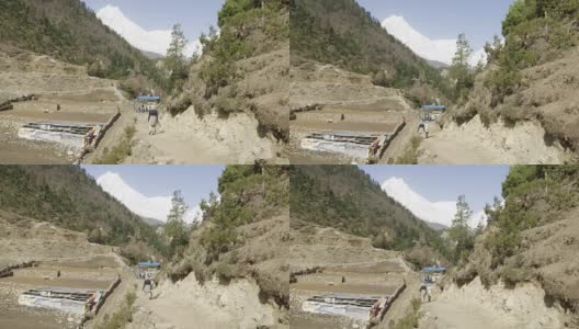 尼泊尔马纳斯鲁地区的游客徒步行走在喜马拉雅山脉。高清在线视频素材下载