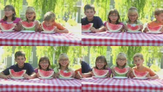 孩子们微笑着吃着西瓜高清在线视频素材下载