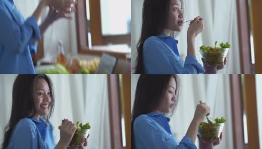 面部表情由年轻女子在清纯的清晨时分，吃着沙拉高清在线视频素材下载