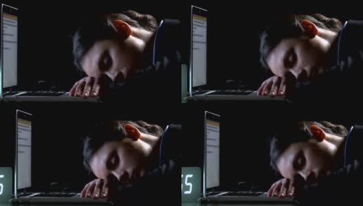 疲惫的员工睡在笔记本电脑上，不规律的工作时间，夜班高清在线视频素材下载