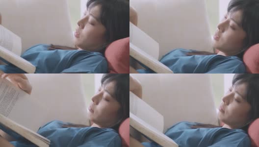 近距离的女人看书，而躺下。悲伤的高清在线视频素材下载