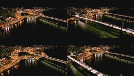 夜间无人机飞过Hercílio卢兹桥，Florianópolis，圣卡塔琳娜，巴西高清在线视频素材下载