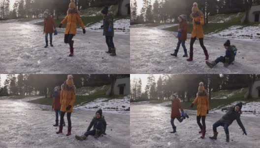 孩子们踢雪和冰玩得很开心高清在线视频素材下载