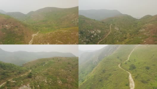 沿着山间的徒步小径飞行。灵汇山，香港大屿山郊野公园高清在线视频素材下载