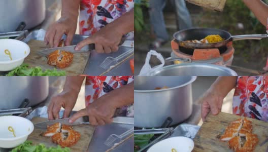 泰国菜。女人切一块鸡肉高清在线视频素材下载