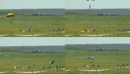 人们在降落伞上着陆高清在线视频素材下载