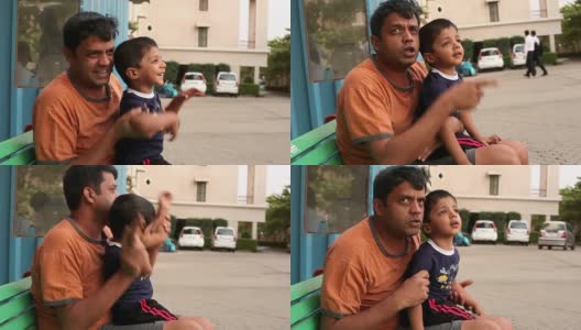 快乐的印度男孩和他的父亲玩高清在线视频素材下载