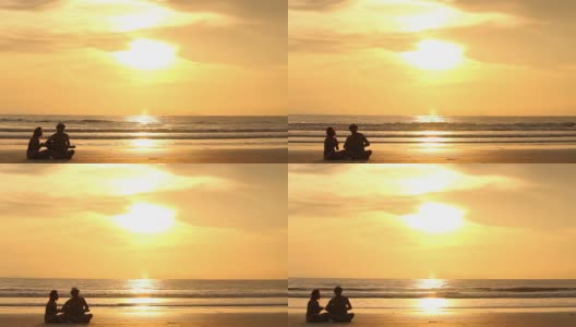 一对剪影情侣在海滩上唱歌高清在线视频素材下载